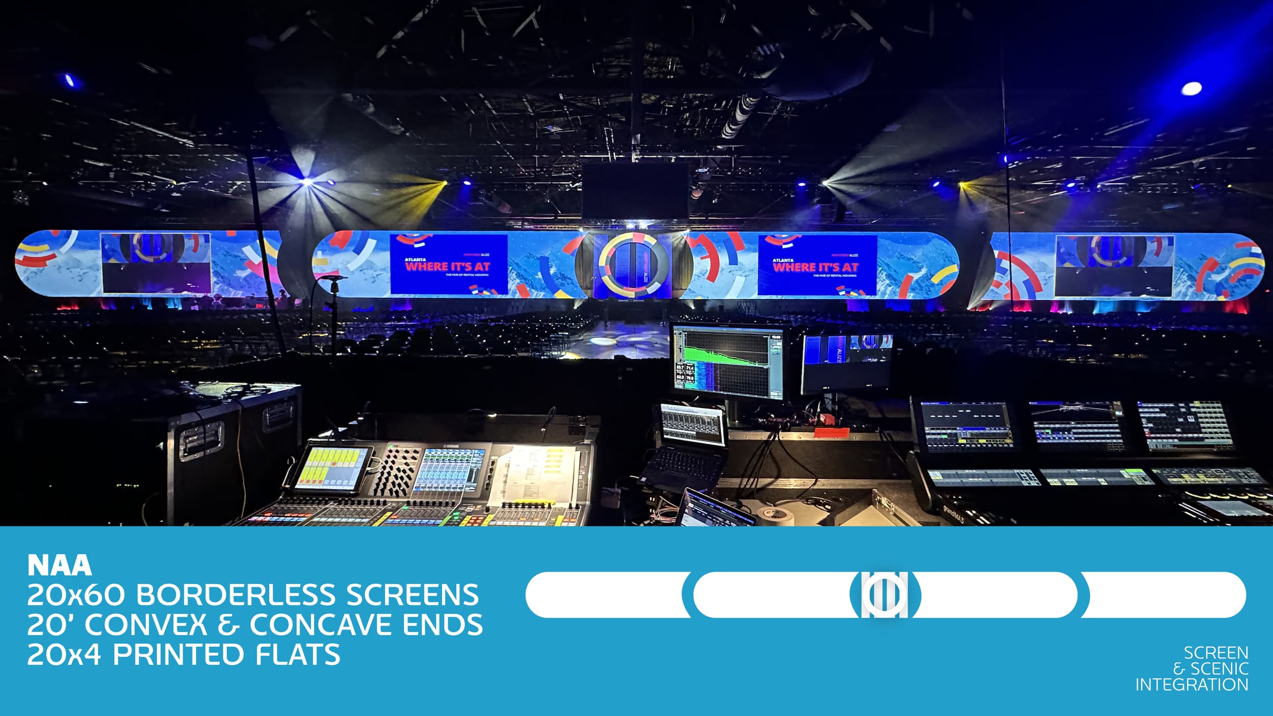 Stage with a large curved LED screen displaying vibrant abstract graphics and text that reads 'WHERE IT'S AT'. In front of the stage, there is audio equipment, including mixing consoles, monitors, and laptops, in a dark room with colorful lighting.